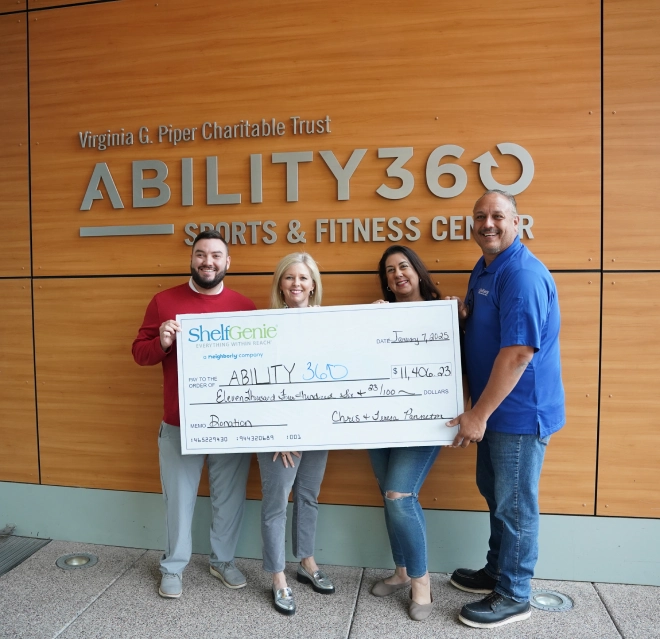 ShelfGenie of West Phoenix owners Teresa and Chris Panneton donating a check of over 11K to Ability 360.