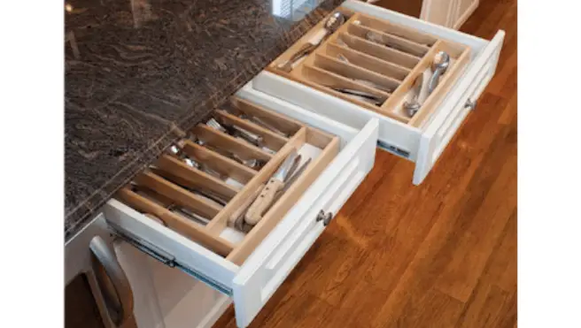 Utensil drawers neatly organized with custom inserts.
