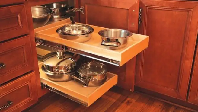 Two shelves in a kitchen cabinet.