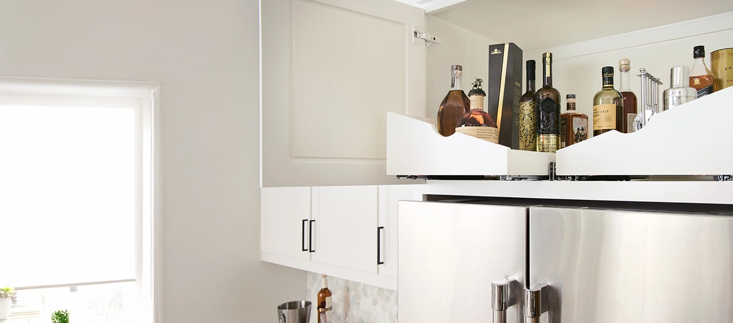 Wine shelving above refrigerator.