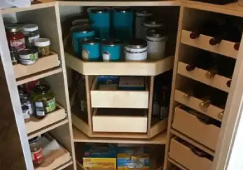 Tall organized pantry with tons of shelving.