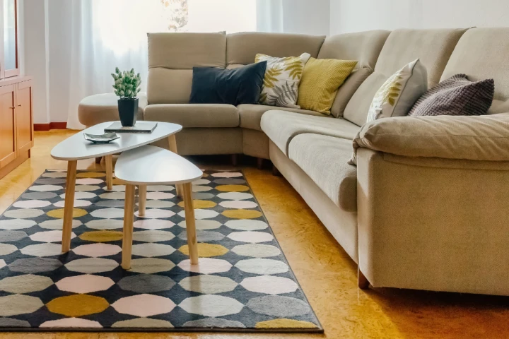 Nesting coffee tables are sized at different heights to fit one under the other.