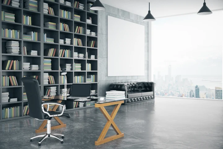 A room with a bookcase and a desk.