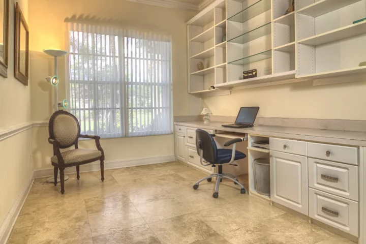 A room with a desk and a chair.