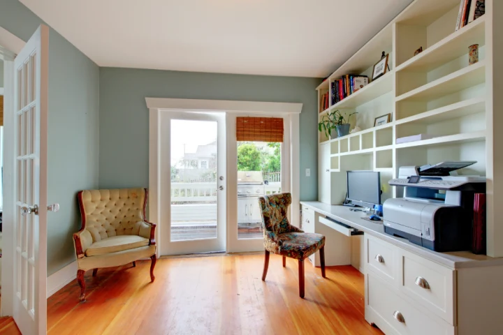 A room with a desk and chair.