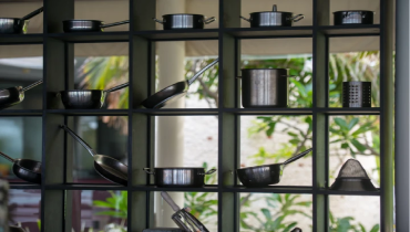 a shelf with pots and pans.