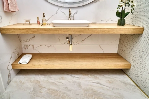 Floating wooden basin countertops with white ceramic sink.