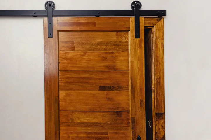 Farmhouse sliding door hallway closet.