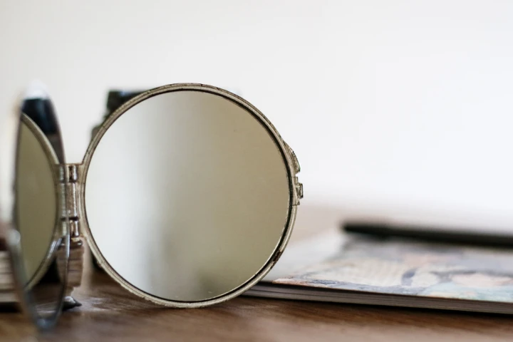 Tabletop mirror on storage desk.