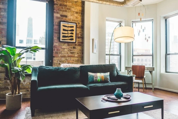 A living room with a couch and a coffee table.