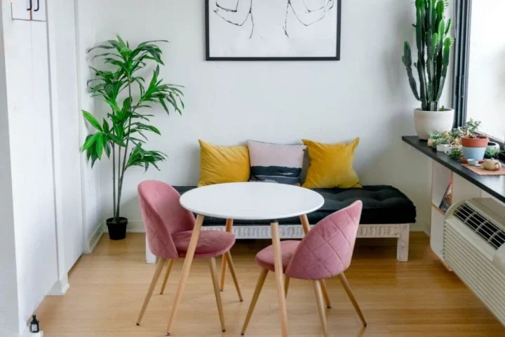 A room with a table and chairs.