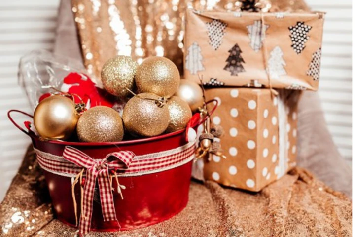 Christmas decorations and painted bucket.