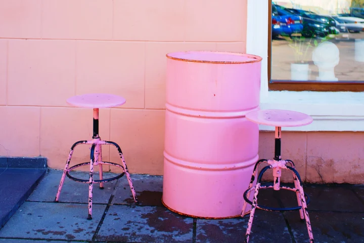 Painted indoor storage drums.